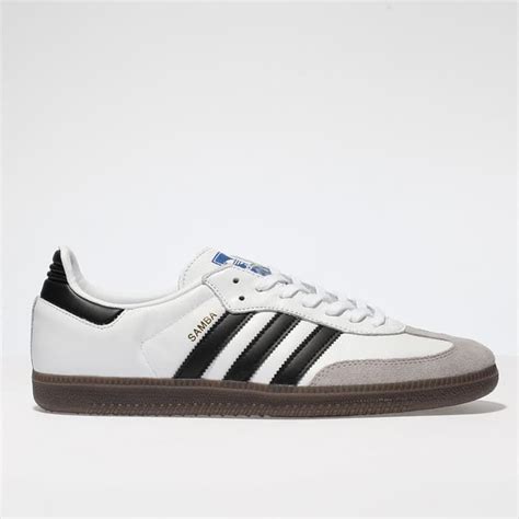 white and grey sambas.